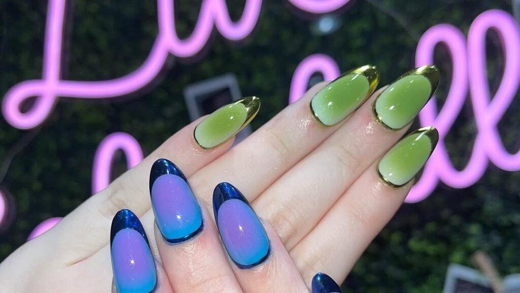 Split chrome manicure with green-gold nails on one hand and blue-purple chrome nails on the other