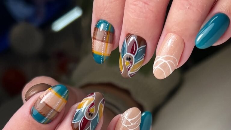 Close-up of a hand showing a Thanksgiving-themed manicure with a hand-painted turkey design, teal accent nails, and brown plaid pattern nails on a nude gel base
