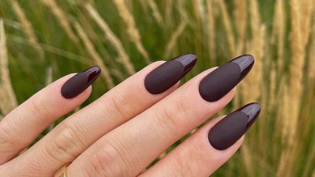 Matte and glossy chocolate brown almond nails with a two-tone finish contrast