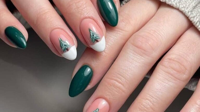 Deep green nails with a hand-painted mini Christmas tree on a white French tip accent nail
