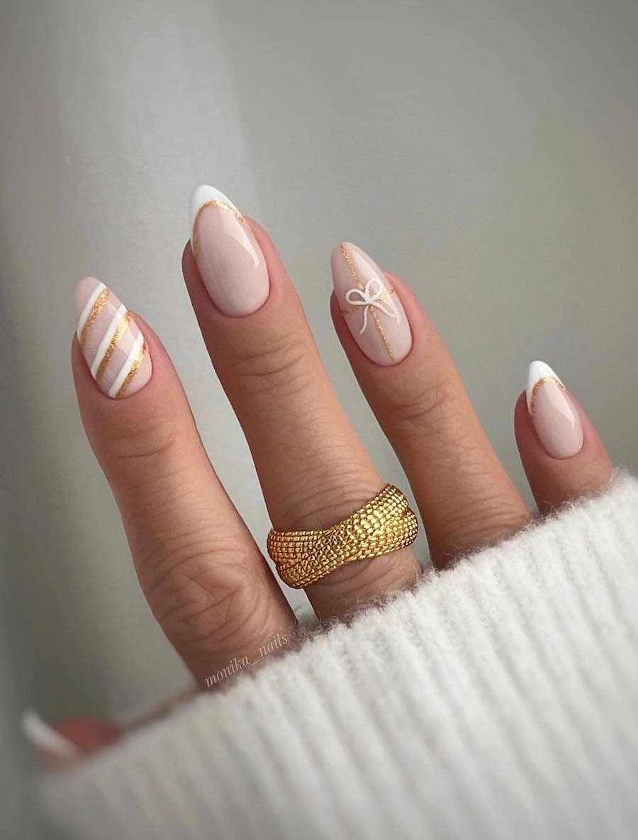Elegant nails with gold accents.