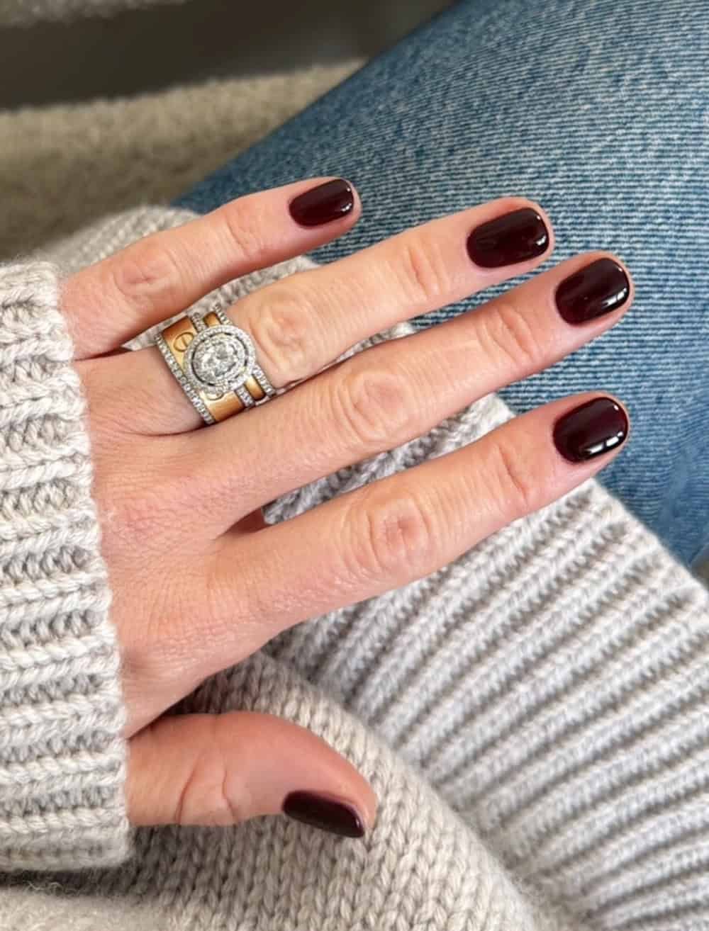 Elegant hand with dark nail polish