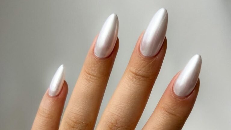 Pearl white chrome almond nails with a gold ring, white Christmas nail design