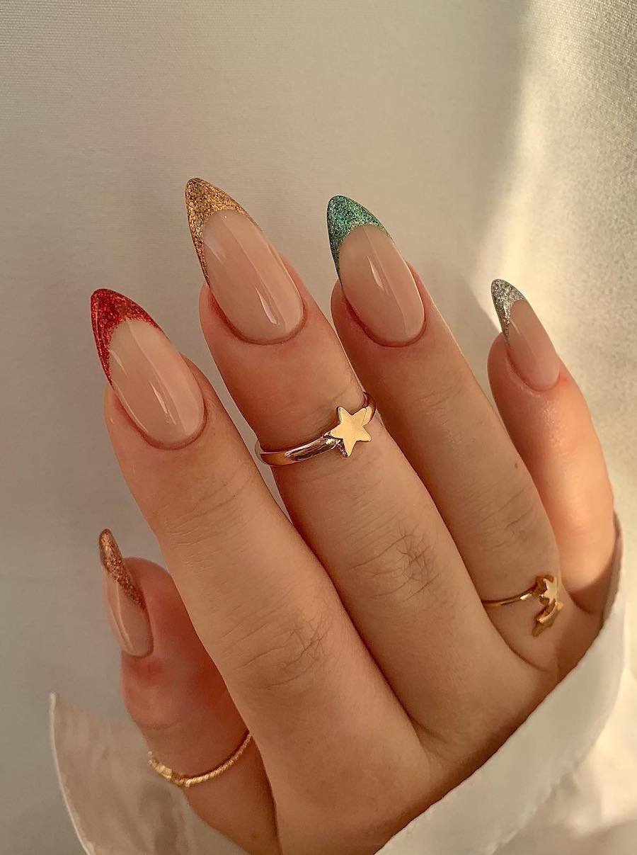 Glittery French tip manicure design.