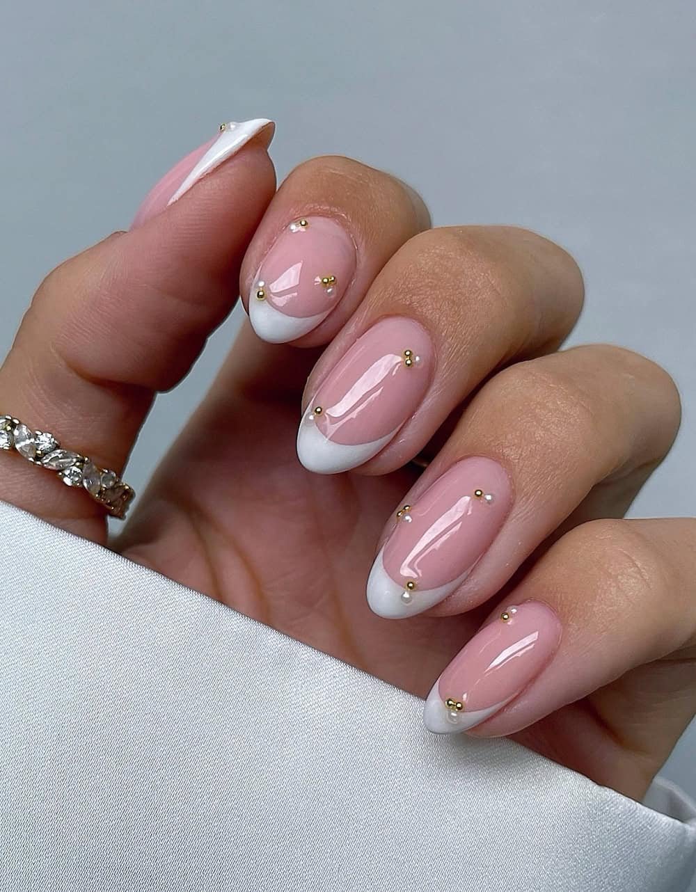 Elegant French manicure with embellishments