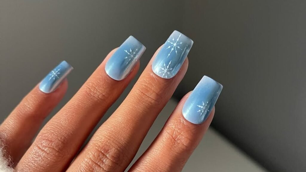 Blue ombre coffin nails with white snowflake nail art design for winter