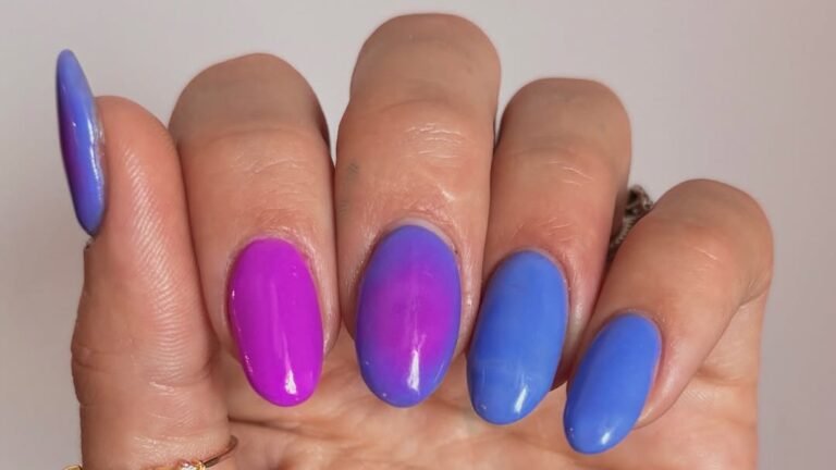 Purple, magenta, and blue winter aura nail ideas with soft blended color-shift on almond-shaped nails