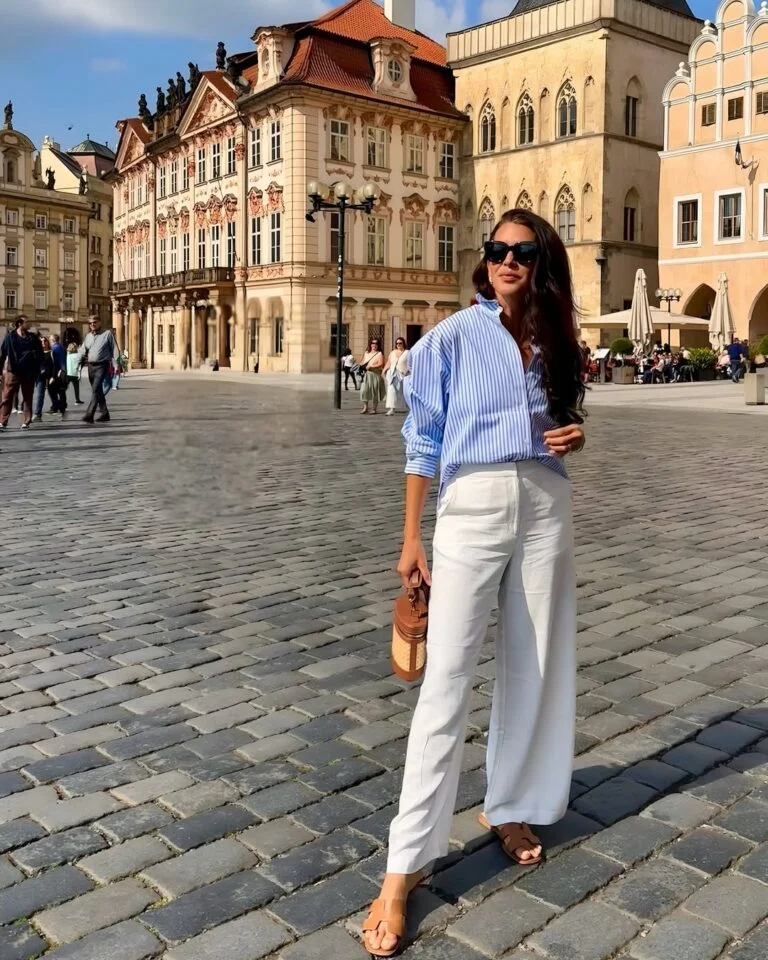 Stylish woman in urban setting.