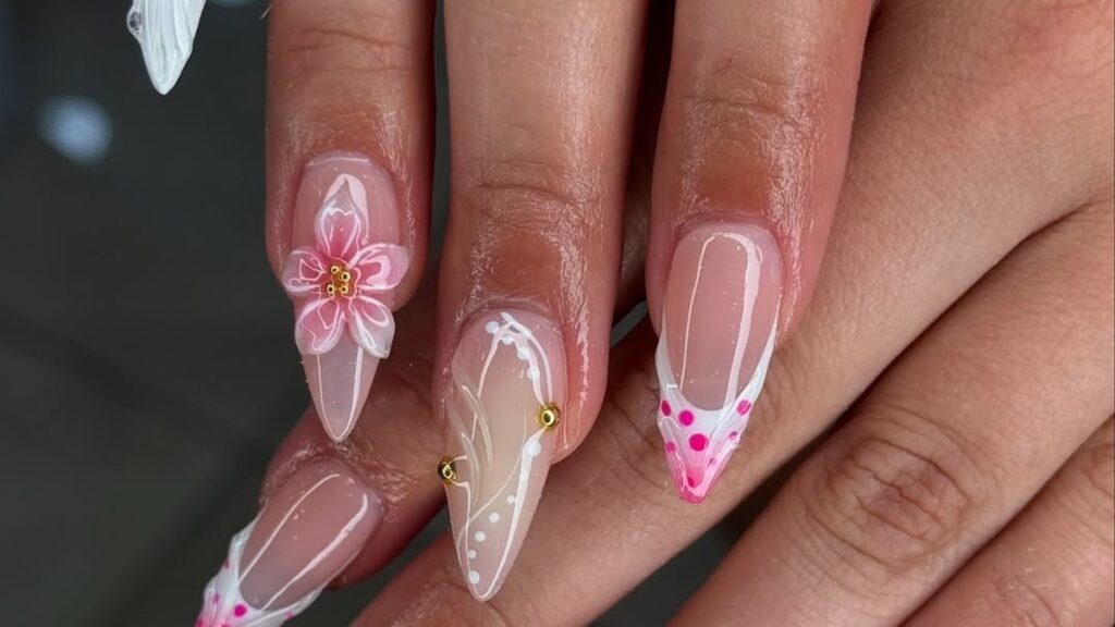 Pink and white nail ideas featuring a 3D floral appliqué, negative-space beading, and a polka-dot French tip against bare nail