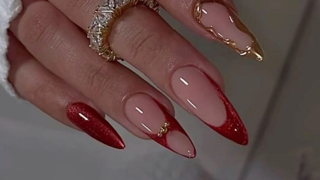 Red glitter French tip nails next to a nail outlined in a thick gold line that drips off the tip, showing gold as an outline rather than a fill