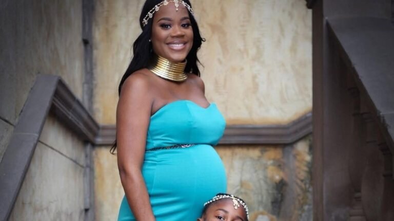 Pregnant woman wearing a bold statement dress with a relaxed, flowing silhouette