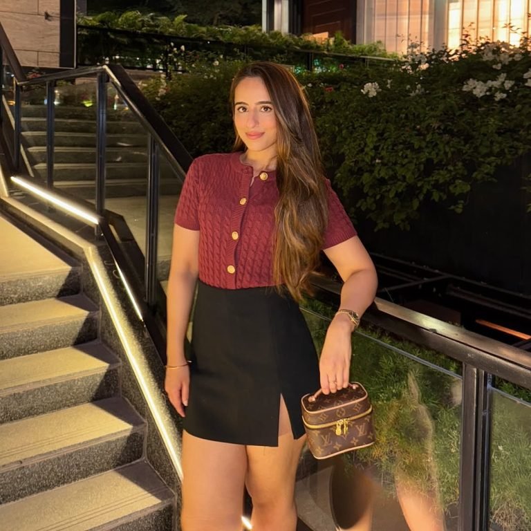 Woman in stylish outfit outdoors.