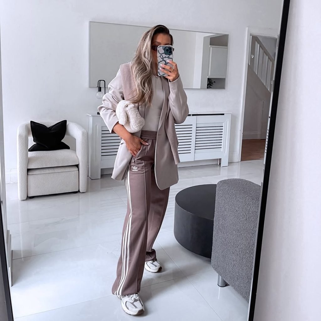 Casual outfit with soft neutral tones.