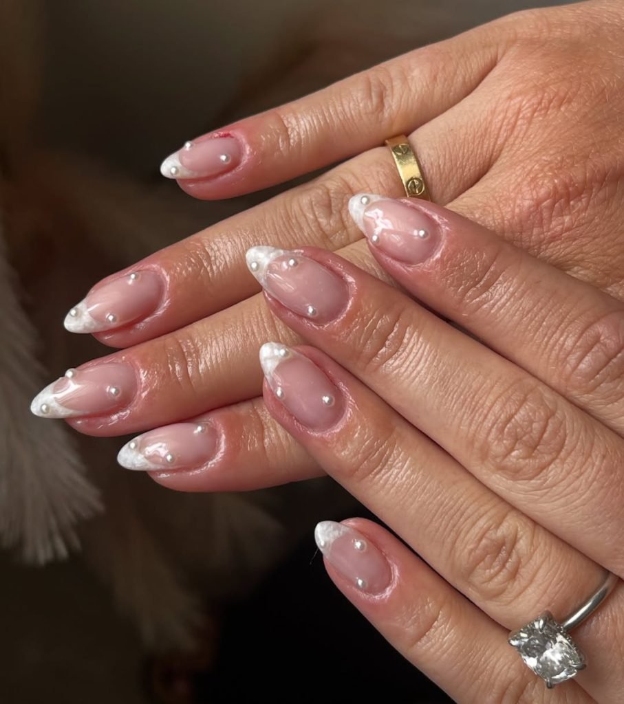 Elegant nails with white tips and pearls