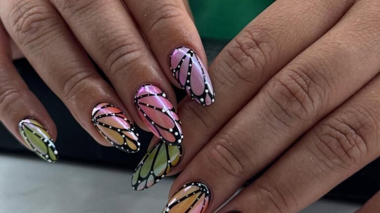 Full nail butterfly wing art with pink, peach, and lime gradient panels outlined in black on almond-shaped nails