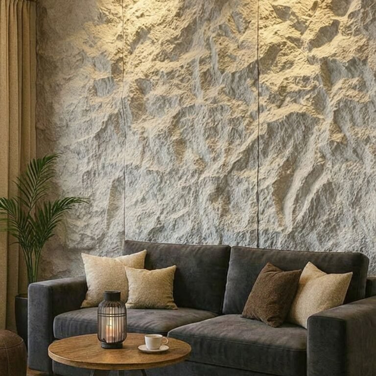 Living room with three floor-to-ceiling rough-cut stone panels behind a dark velvet sofa, lit from above to cast shadows across the texture, with golden curtains framing the left edge