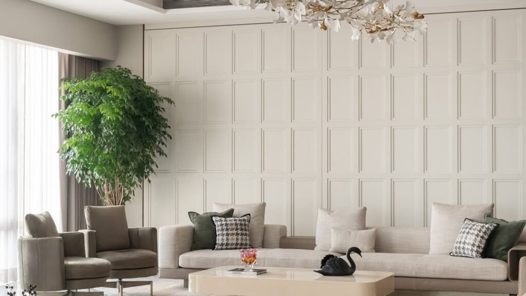 Rounded sculptural sofa anchoring a modern living room with a floral chandelier and travertine coffee tables