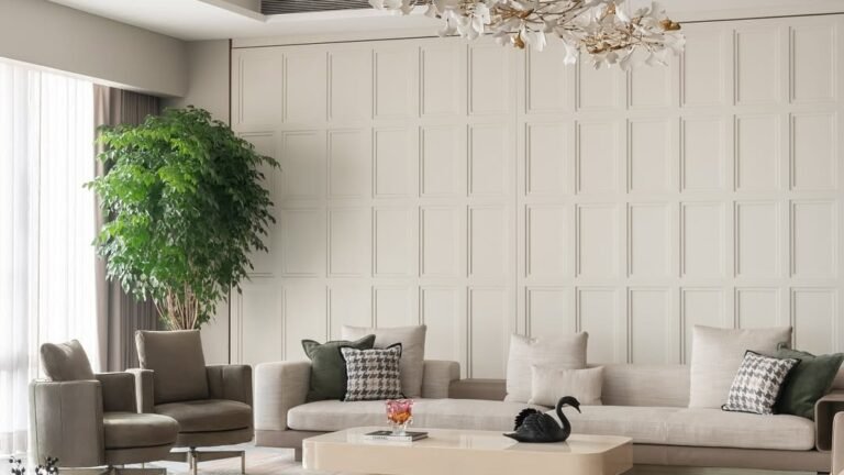 Rounded sculptural sofa anchoring a modern living room with a floral chandelier and travertine coffee tables