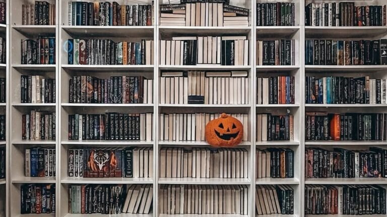 Single carved pumpkin centered on a white bookshelf wall, styled as Halloween bookshelf decor